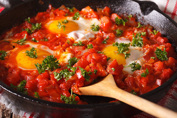 istock shakshuka fried eggs with sauce closeup in a frying pan 626841882