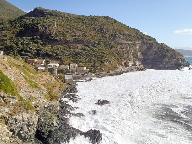 Beach with strong Mistral wind Corsica, France: Coast of Cap Corse and Nonza Beach in rough seas and strong Mistral wind mistral wind stock pictures, royalty-free photos & images
