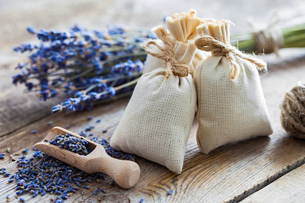 Bunch of lavender flowers and sachets. Bunch of lavender flowers and sachets filled with dried lavender. sachet stock pictures, royalty-free photos & images