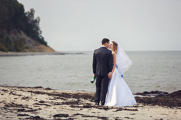 istock Happy wedding couple on the shore 626844998
