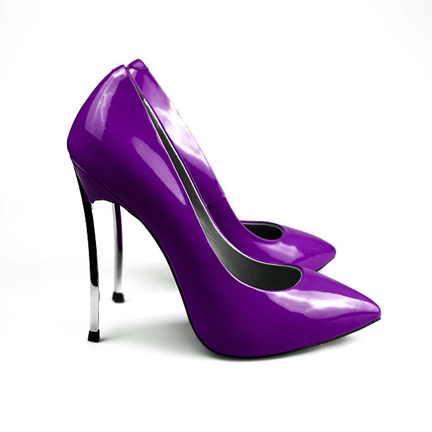 istock purple female shoes over white 626850876
