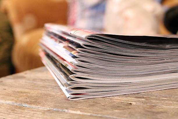istock Magazines on the wooden table 626851274