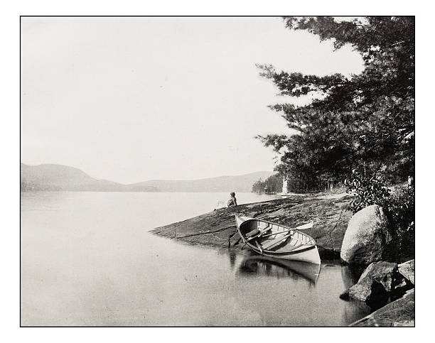 Antique photograph of Lake George Antique photograph of Lake George canoe photos stock illustrations