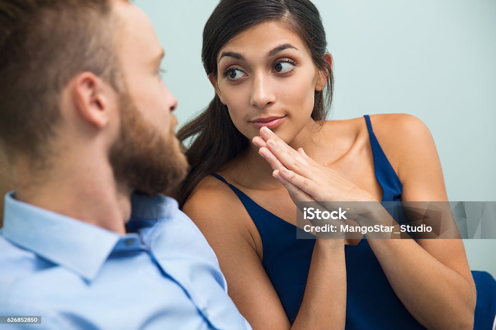 Young woman asking her husband about something Latin American young woman asking her husband about something or pleading to forgive her. She looking at him in anticipation Adult Stock Photo
