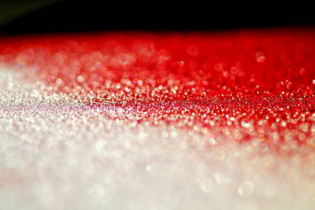 Abstract red winter background. Abstract red winter background. Snowflakes. The small depth of field. Snow on car surface. godspeed stock pictures, royalty-free photos & images