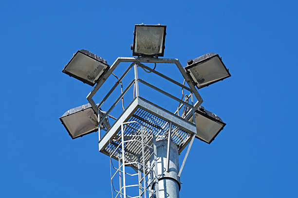 istock park light poles with white clouds and blue sky backgrounds 626853508