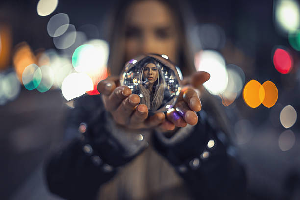istock Girl holding crystal ball 626854268