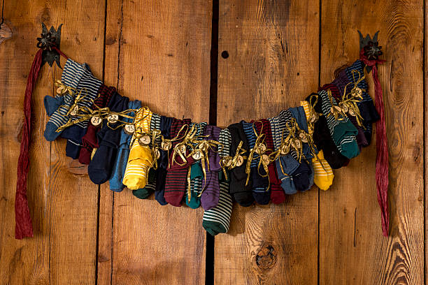 Lovely colorful Sock Advent Calendar on wood. stock photo