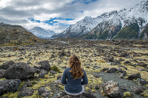 istock Happy Young woman walking in the mountains 626856448