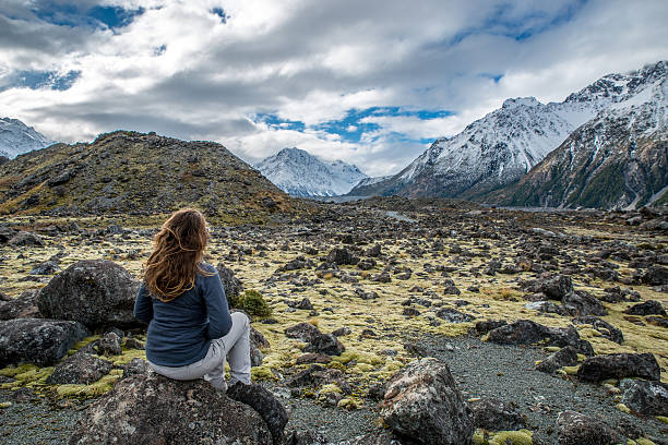istock Happy Young woman walking in the mountains 626856822