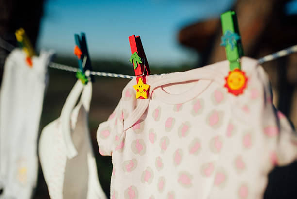 istock baby clothes drying on a rope in the woods 626862762
