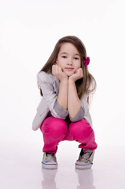 istock Little girl isolated on white background. Studio shot. 626866296