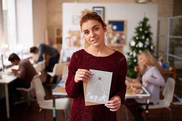 Smiling woman with Christmas cards