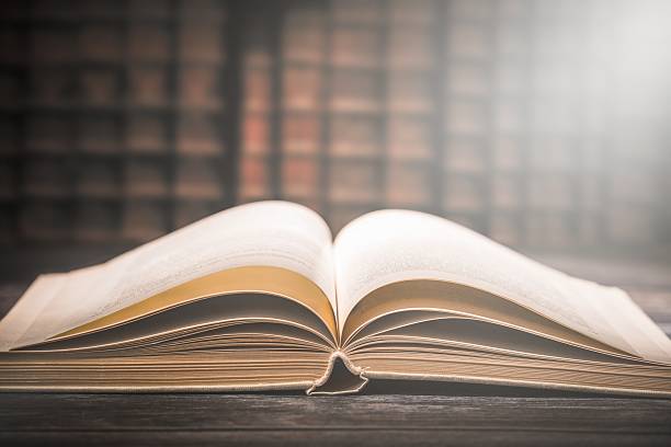 istock Old book wooden library desk concept. 626867520
