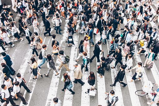 People crossing the street on walkway