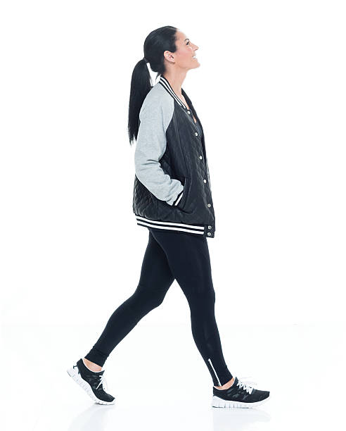 istock Smiling woman walking and looking up 626868022