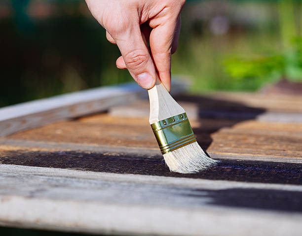 istock Paint brush on wooden table use for home decorated. 626868214