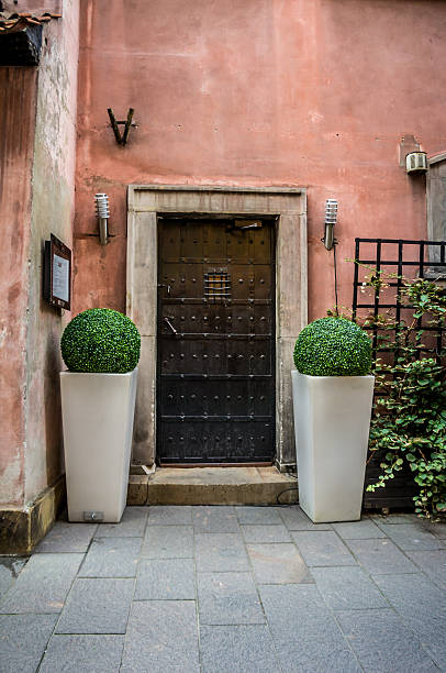 istock Vintage door, metal belts and rivets, barred window 626873732