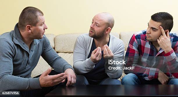 Three Males At Home Stock Photo - Download Image Now - Men, Group Of People, Only Men