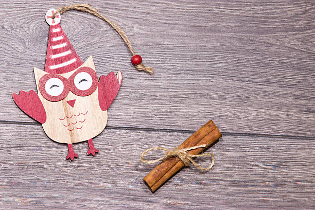 istock Christmas toy. Wooden owl on a tree. 626875356