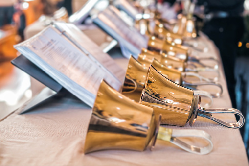 Handbells with sheet of music ready for performance