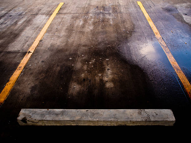 istock Wet floor of Carpark lene after the raining time 626876308