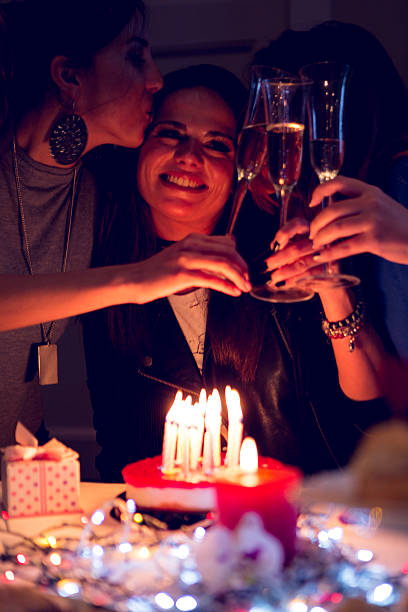 istock Birthday. Girls with a cake, candles and gifts 626890708