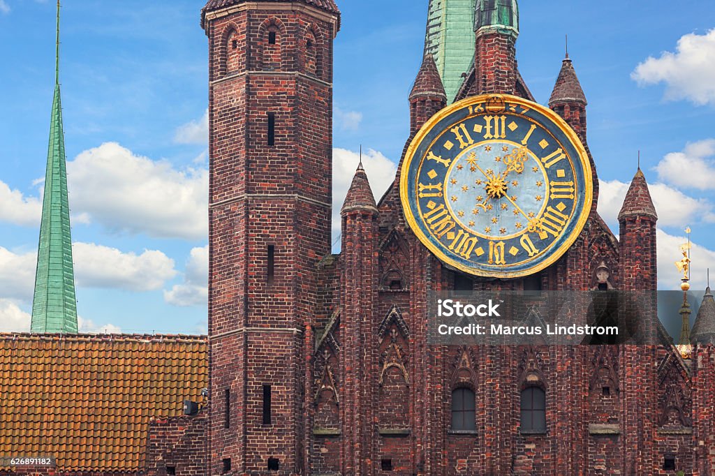 St Mary's Church in Gdansk Detail of the facade, clock, and tower of St Mary's Church in Gdansk, Poland. The church was completed in 1502, and is one of the largest brick churches in the world. Gdansk Stock Photo