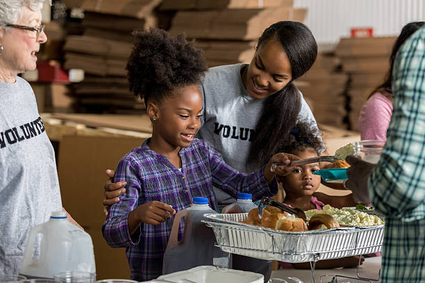 istock Diverse volunteers serve food in soup kitchen 626891276