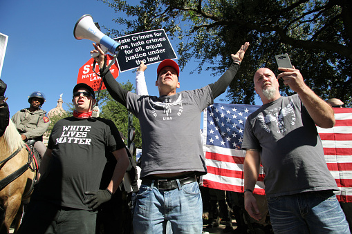 Austin, Texas, USA - November 19, 2016: A group of 'White Lives Matter' demonstrators protest just south of the Capitol grounds. The 'White Lives Matter' demonstrators, numbering about 20 people at the most, came from Houston with the message that the hate crime law is unfair to white people.