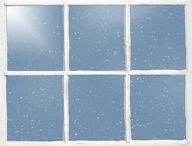 istock windowpane with snowflakes and sunlight 626906910