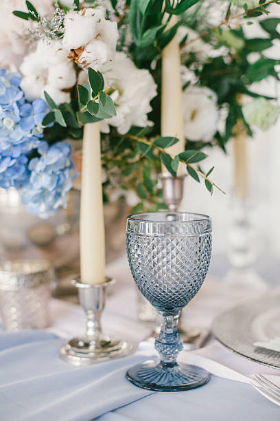 istock Silver candlestick as element of festive table wedding decorations. 626915414