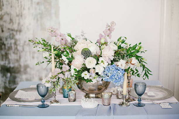 Silver candlestick and other elements of festive table wedding decorations.