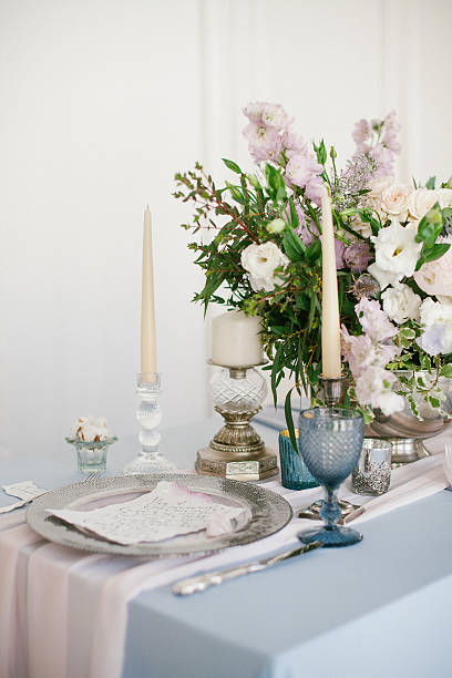 istock Silver candlestick and other elements of festive table wedding decorations. 626915562