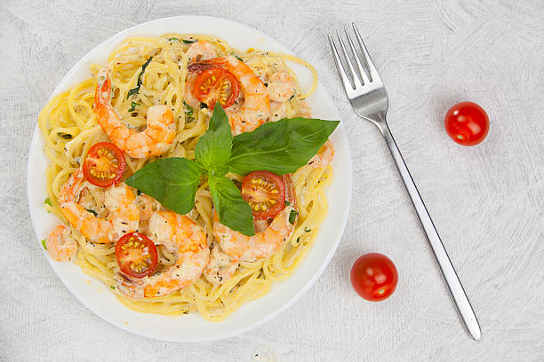 istock delicious delicious spaghetti with shrimps and basil on  plate 626916114