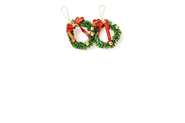 istock Green christmas wreath with decorations isolated on white background 626916884