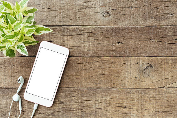 istock phone blank white screen on old wood table, mockup phone 626917152