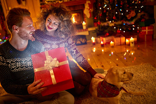 istock Couple with magical gift for Christmas 626917262