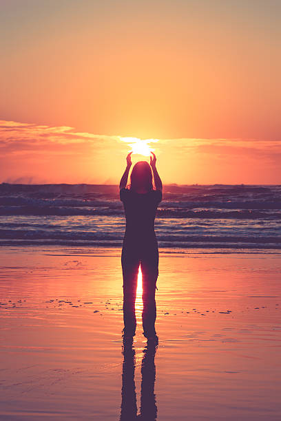 istock Woman Silhouette on a Tropical Beach at Sunrise 626917854