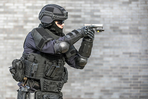 istock SWAT Police Officer Against Brick Wall 626917986