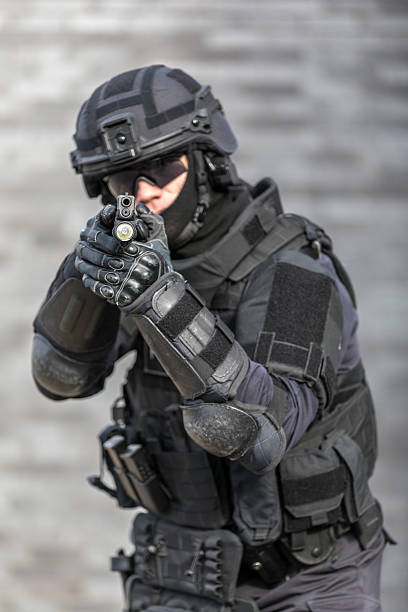 istock SWAT Police Officer Against Brick Wall 626931522