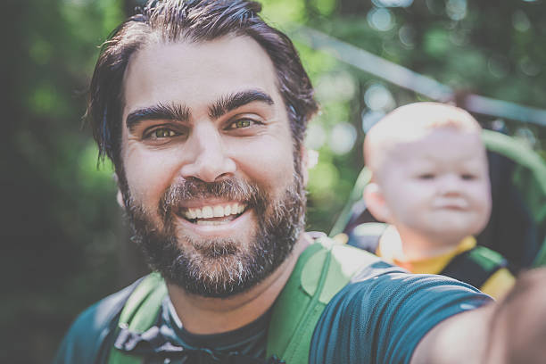 istock Father Backpacking Hiking with Baby in Forest 626931942