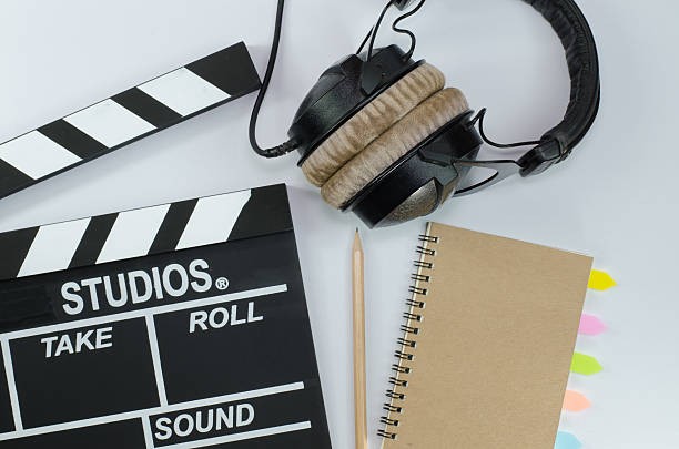 istock Slate film and notebook headphone white background 626942614