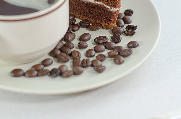 cup of coffee chocolate cake on white background - latté hot chocolate hot drink indulgence imagens e fotografias de stock