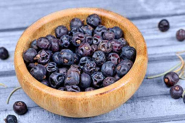 istock Juniper in a bowl on wooden table 626943404