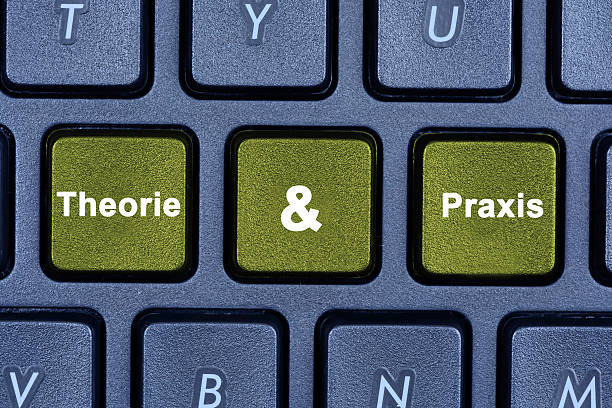 Theorie & Praxis words on keyboard button stock photo