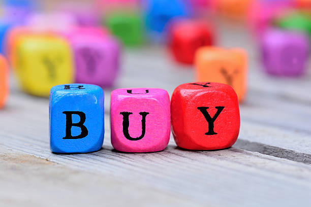 istock Buy word on wooden table 626944916