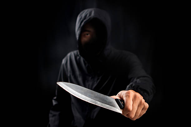 istock Dangerous criminal hold knife in hand. 626945672