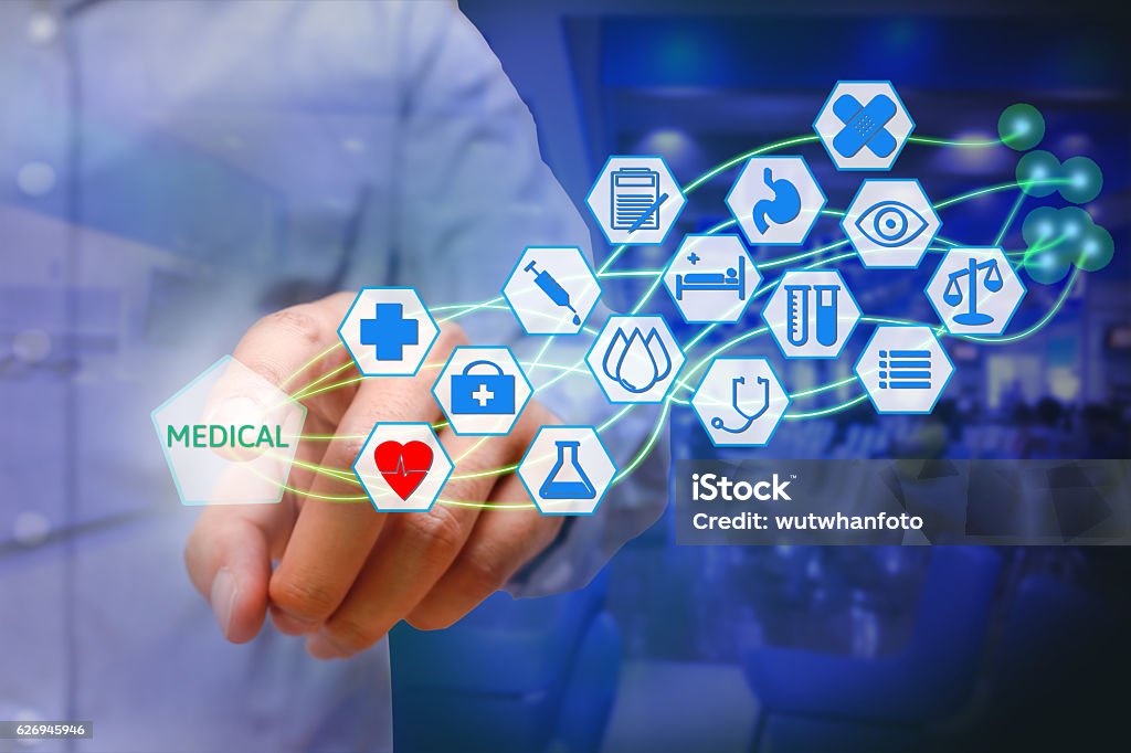 Asian young man pressing medical icon on virtual screen. Healthcare Asian young man pressing medical icon on virtual screen. Healthcare concept. Icon Symbol Stock Photo