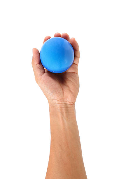 istock one hand holds stress ball isolated on white 626946586